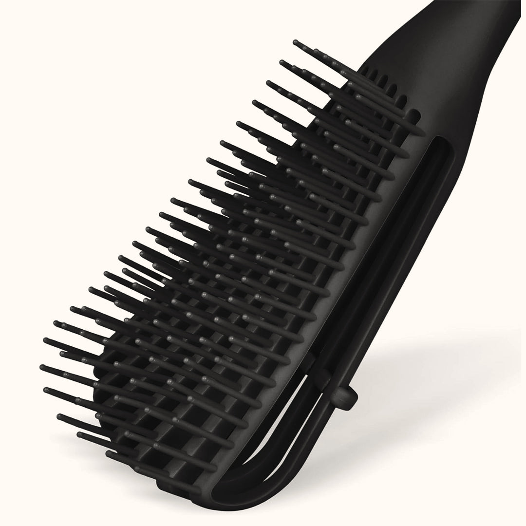 Close-up of the separate rows of bristles and the open back of the head