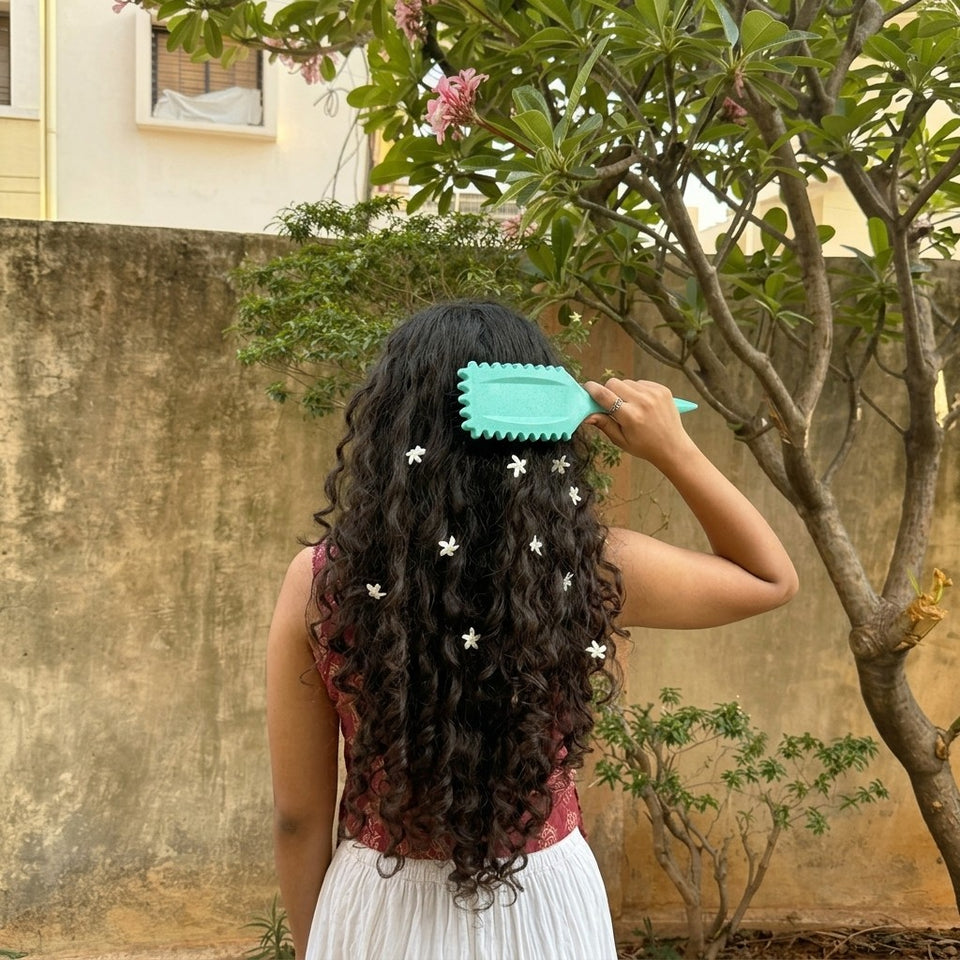 Long curls with small flowers, the aqua curl brush held at the crown