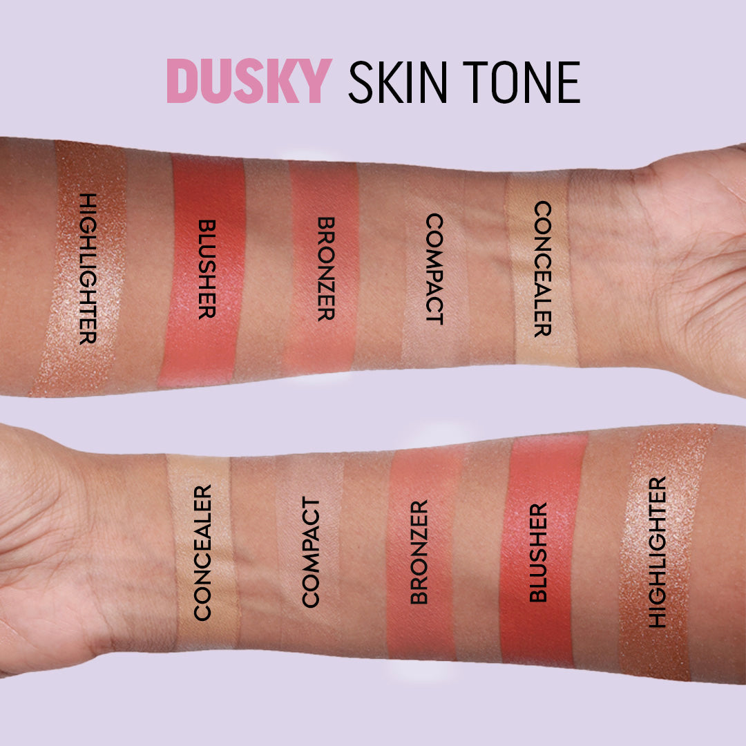 Dusky tone: highlighter, blusher, bronzer, compact and concealer swatched in labelled stripes on two forearms